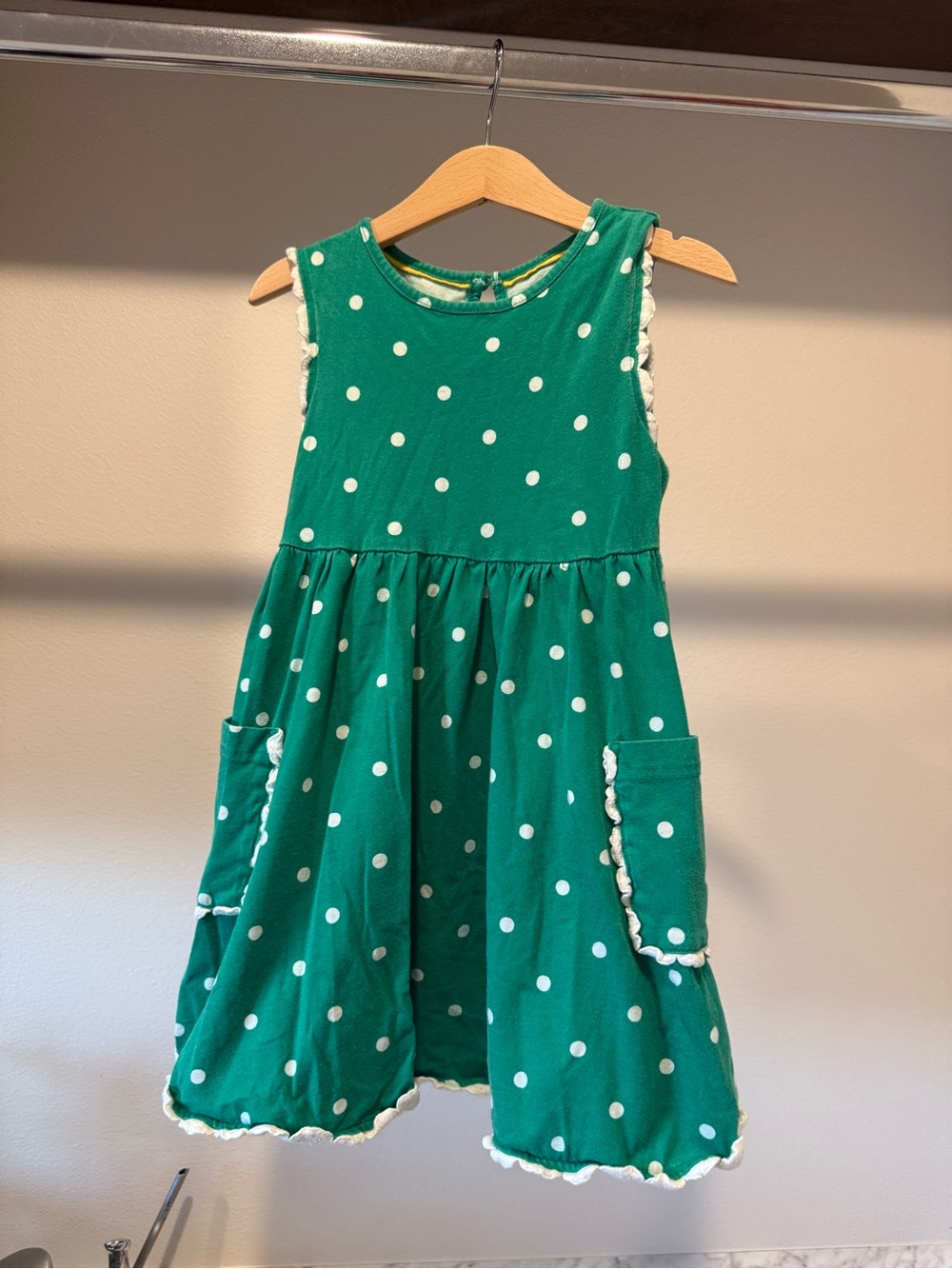 Mini Boden green skater polka dot dress with pockets. Girl size 5-6Y